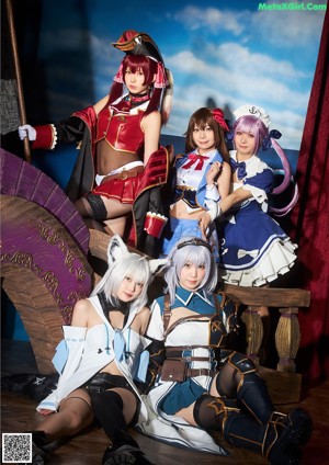 A group of three women dressed in sailor outfits posing for a picture.